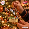 Close-up of a Cincinnati Bengals Ja'Marr Chase Christmas ornament hanging on a lit tree.