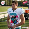 Man wearing Coastal Carolina Chanticleers 90s Friday Night Football Jersey on field.