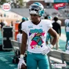 Player wearing a Coastal Carolina Chanticleers 90s Friday Night Football Jersey on a field.
