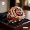 Closeup of Coca-Cola 140th Anniversary 1886 - 2026 Ring featuring a large red gem and bottle graphic in a display box.