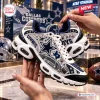 Side view of Dallas Cowboys AT&T Stadium Air Max Plus Sneakers with rhinestones and star graphics.