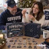 Couple opening Dallas Cowboys Christmas Advent Calendar together.