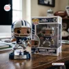 Front view of Dallas Cowboys Cornell Green vinyl figure standing outside its branded box.