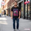 Front view of a man wearing a black Dallas Cowboys NFL Breast Cancer Awareness Shirt on a city sidewalk.