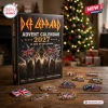 Front view of Def Leppard 2027 Advent Calendar box with themed pins arranged on a wooden table.