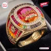 Closeup of the Def Leppard Rock Brigade 2027 Tour Ring featuring red center stone and colorful stones.