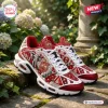 Side view of Delta Sigma Theta Elephant Air Max Plus Sneaker with red, white, and gold details.