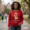 Front view of a woman wearing a Delta Sigma Theta red sweatshirt featuring a bear graphic.