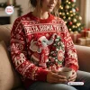 Front view of a red Delta Sigma Theta ugly Christmas sweater featuring an elephant and a holiday tree.