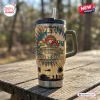 Front view of Desert Storm 35th Anniversary Stanley Tumbler with military emblem on wood table.