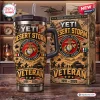 Front view of Desert Storm Marine Corps YETI tumbler cup with military graphic and matching box on wooden shelf.