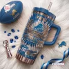 Top view of Detroit Lions 96th Anniversary Tumbler with Handle on fuzzy white surface.