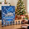 Front view of Detroit Lions Advent Calendar packaging with figurines displayed on a wooden table.