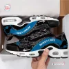 Side view of Detroit Lions Black Air Max Plus Sport Shoes featuring blue text and white soles inside a box.