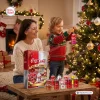 Family near a Christmas tree with the Diet Coke & Coca-Cola All Flavors Advent Calendar 2026 on a wooden table.