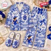 Flat lay of blue and white Dior Zeta Phi Beta Satin Pajama Set with slippers.