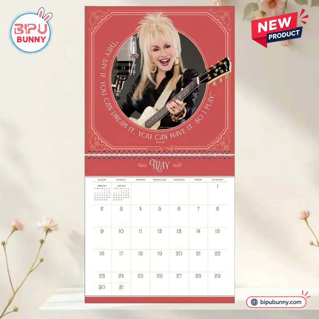 Front view of Dolly Parton 2027 Wall Calendar showing May monthly page with portrait and guitar.