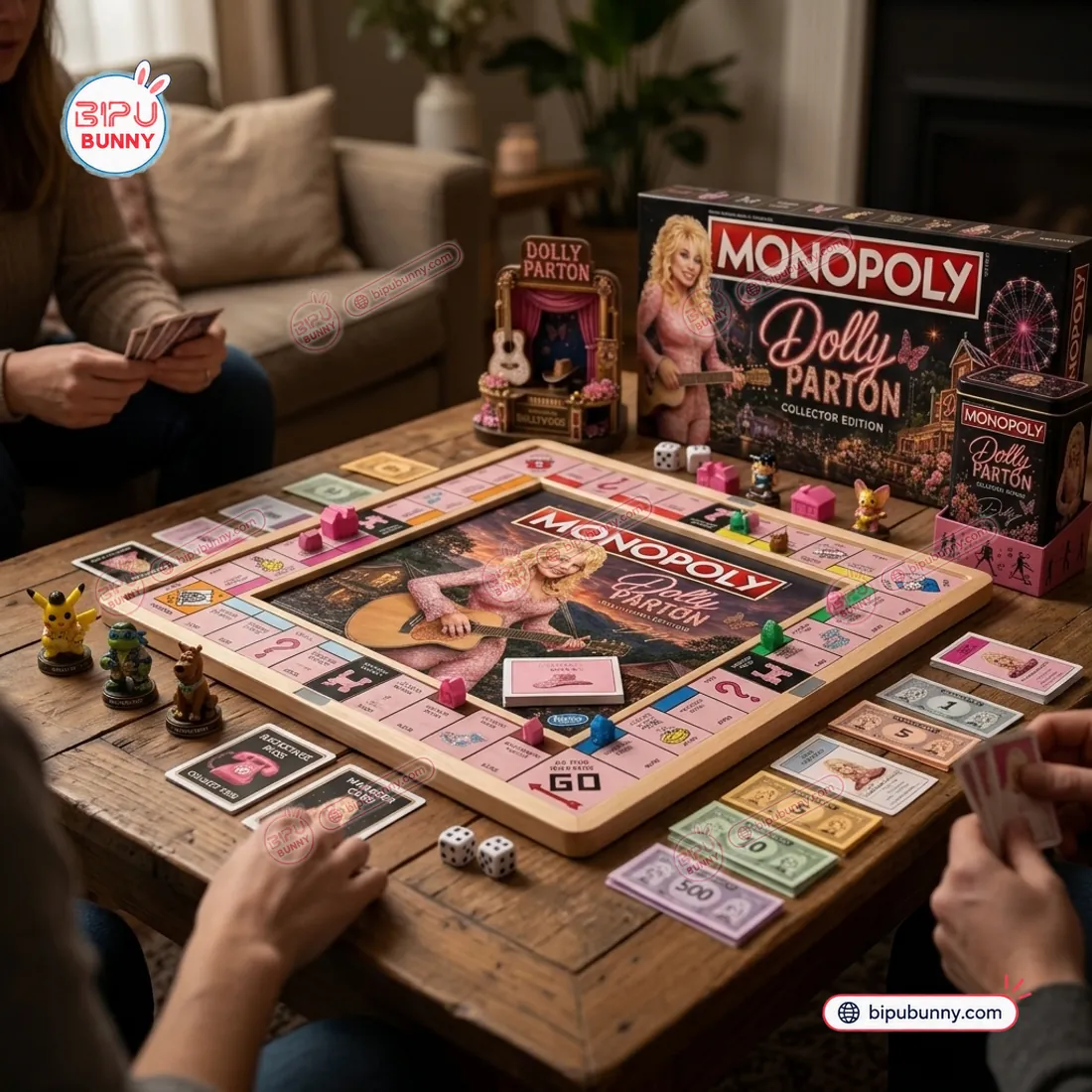 Tabletop game night view of the Dolly Parton Collector Edition Monopoly Board Game showing the wood-framed board, pink houses, and miniature Dollywood stage