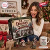 A smiling woman holding the Donkeys Bad Decisions Advent Calendar in a holiday setting.
