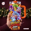 Hand holding a Dragon Ball Anime Christmas Tumbler with Handle featuring festive characters and snow elements.