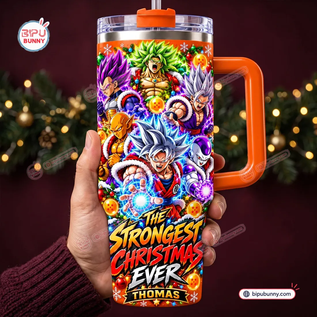 In-hand view of the Dragon Ball Anime Christmas Tumbler with Handle showing the six-fighter holiday collage and orange side handle