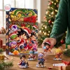 Front view of a Dragon Ball Z Advent Calendar Blind Box next to several miniature figures on a wooden table.