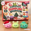 Front view of a Christmas dumpling squishy toy advent calendar box with three matching figures placed in front.