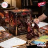 Closeup of red dragon figurine next to its packaging on a table with roleplaying game sheets.