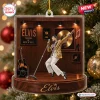 Front view of an Elvis Presley 2026 Christmas Ornament featuring a miniature singer figurine on a wooden stage diorama.