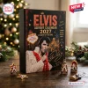 Front view of an Elvis Presley Advent Calendar 2027 box with small themed ornaments displayed on a wooden table.
