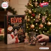 Front view of Elvis Presley Advent Calendar 2027 Ornaments with figurines displayed on a table near a Christmas tree.