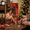 Front view of an Elvis Presley Christmas Advent Calendar displayed with figurines and keychains on a table.
