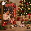 Front view of an Elvis Presley Christmas Advent Calendar with mini figurines and holiday decor on a wooden table.