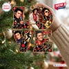 Close-up of Elvis Presley Love Christmas Ornament held against pine branches.