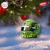Hanging miniature racing helmet ornament on a Christmas tree with snowy background for an F1 2026 Racing Helmet Advent Calendar.