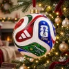 Close-up view of the FIFA World Cup 2026 Trionda Ball Christmas Ornament hanging on a lit tree.