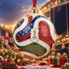 Close-up of a FIFA World Cup 2026 USA Canada Mexico Host Nations Trionda Ball Christmas Ornament hanging in front of a stadium.