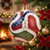 Close-up view of the FIFA World Cup 2026 USA Canada Mexico Trionda Ball Christmas Ornament hanging on a tree.