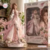 Front view of Final Fantasy Aerith Gainsborough Vinyl Figure standing beside its retail packaging box.