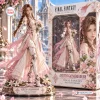 Front view of the Final Fantasy Aerith Gainsborough vinyl figure displayed beside its decorated packaging box.