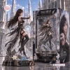 Side view of a Final Fantasy Tifa Lockhart 40th Anniversary Figure standing beside its ornate packaging box.