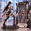 Side view of a Final Fantasy Tifa Lockhart vinyl figure posed next to its collector packaging against a fantasy city backdrop.