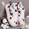 Side view of Flying Ace Snoopy Low-Top Air Force Sneakers featuring white leather and cartoon graphics.