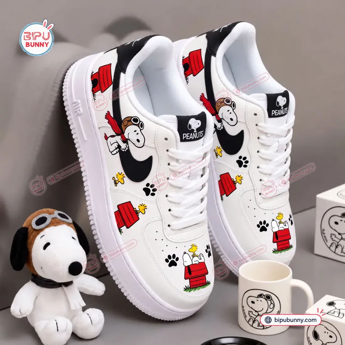 Top-down detail of Flying Ace Snoopy Low-Top Air Force Sneakers showing toe box doghouse art and PEANUTS tongue tag