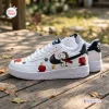 Side view of Flying Ace Snoopy Low-Top Air Force Sneakers with cartoon graphics on white leather.
