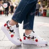 Lifestyle view of Flying Ace Snoopy Low-Top Air Force Sneakers worn with blue jeans outdoors.