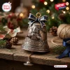 Front view of Robby The Robot 70th Anniversary Bell Ornament on a rustic wooden table with pinecones.