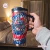 Hand holding a Ford Mustang 62nd Anniversary Handle Tumbler with red, white, and blue patriotic design.