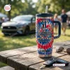 Front view of a Ford Mustang 62nd Anniversary Handle Tumbler on an outdoor wooden table with car keys.