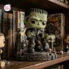 Front view of Frankenstein Monster Halloween diorama figure on a bookshelf.